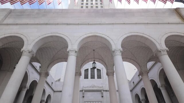 Gimbal close tilting-up shot of iconic City Hall in Los Angeles, California. 4K
