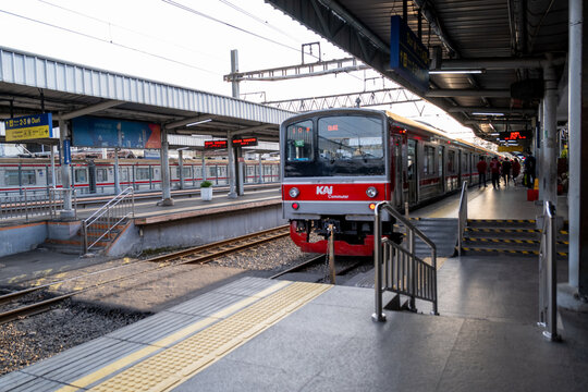 Tangerang, Indonesia - March 24, 2026: A KAI Commuter train at the platform of Tangerang Station, a clean and well-maintained station, in the afternoon.