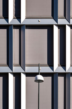 Grid pattern and structure detail on modern geometric exterior of a facade architecture building creates a calm minimalist study in repetition