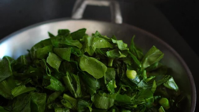 Adding Chinese Kale into Pan for Vegetarian Mushroom Rice Cooking at Home 4K Video