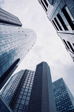 Modern corporate towers and glass skyscrapers in Frankfurt Bankenviertel Germany captured in wide perspective with soaring architecture lines