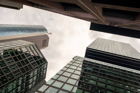 Skyscrapers rise in Frankfurt Bankenviertel Germany as glass office towers form urban architecture captured from a dramatic perspective for corporate stories