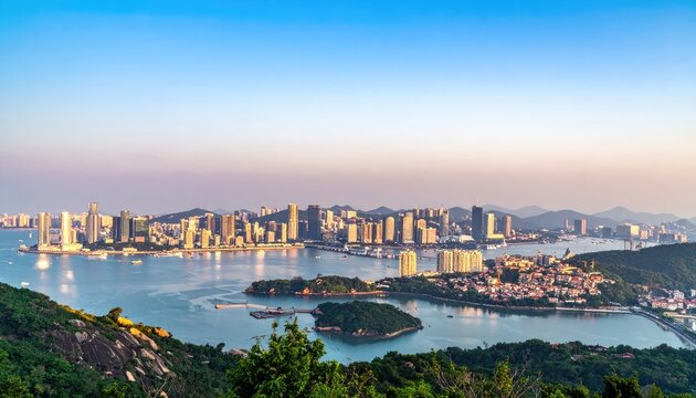 A panoramic view showcases the sprawling cityscape of Macau, nestled along a tranquil bay, bathed in the warm hues of a serene sunset.