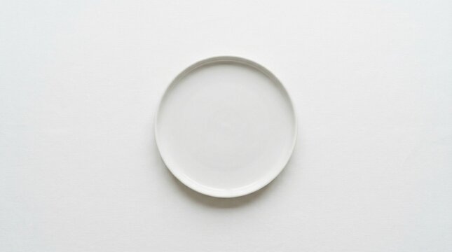 Empty white plate on white background