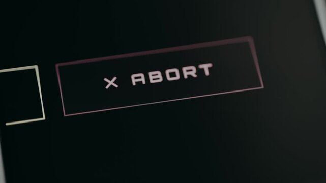 Control button labeled ABORT for canceling or stopping a current action