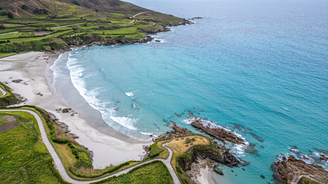 Aerial view of the coastal village of Cai&oacute;n and its bay, Galicia, Spain.