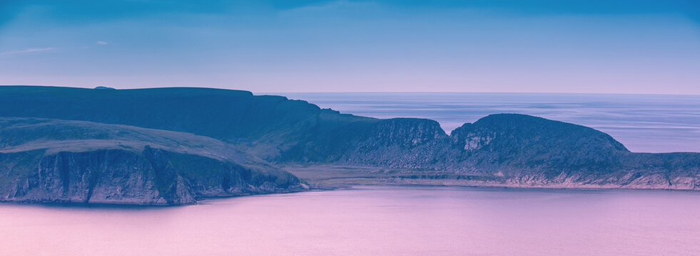 The Barents Sea at sunset. The rocky coast. Beautiful landscape. Northern Cape. North Cape, Norway