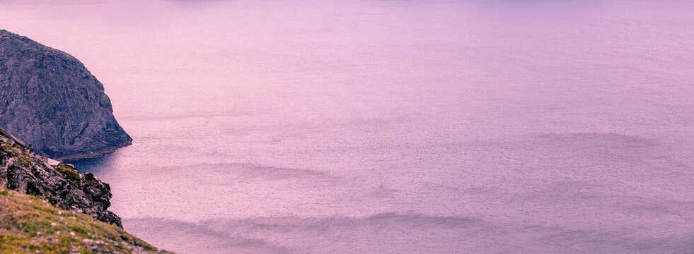 The Barents Sea at sunset. The rocky coast. North Cape, Norway