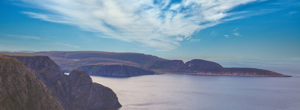 The Barents Sea at sunset. The rocky coast. Beautiful landscape. Northern Cape. North Cape, Norway