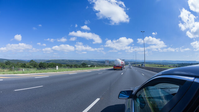 Road Highway Traffic Driving Close-up Passenger View Trucks Vehicles Moving Travel Landscape.