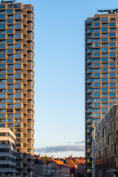 Modern city architecture shows two towers skyscraper building rising with symmetry and perspective under clear sky for bold urban skyline