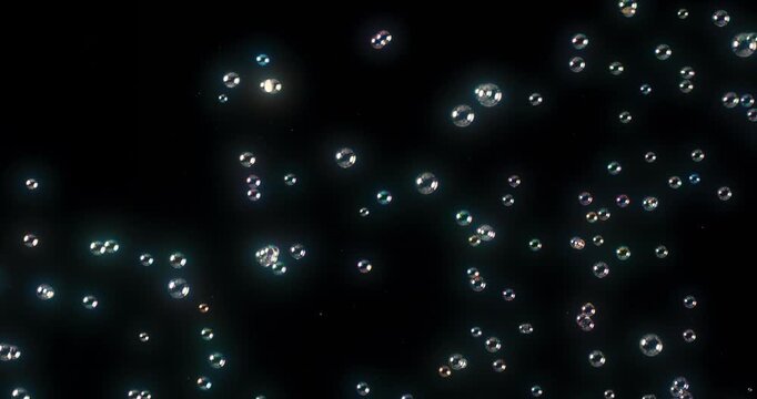 This vibrant abstraction of colorful soap bubbles against a contrasting black background is perfect for motion graphics and creative projects, enhancing their visual appeal and aesthetic value