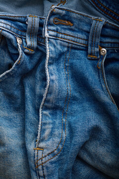 Close-up of the fly of an old pair of jeans.