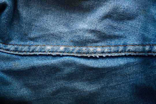 Close-up of the stitching on an old pair of jeans