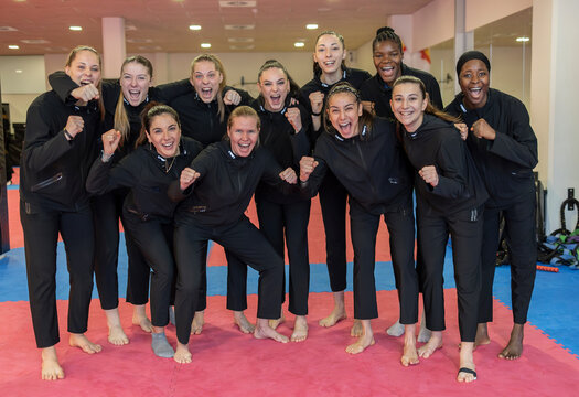 Diverse group of women training at a judo school in Madrid