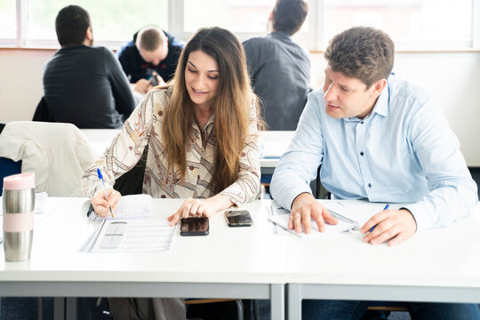 Students engaging in a multicultural classroom discussion and collaborative learning environment