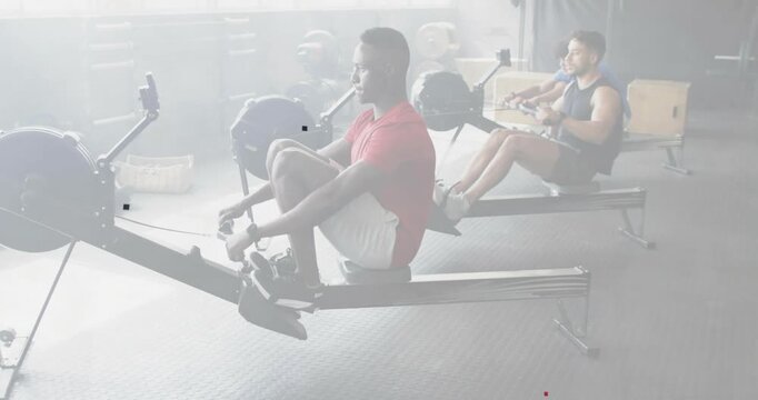 Mobile phone being set aside, lead in red rowing: leg drive, lean, pull, recover for training