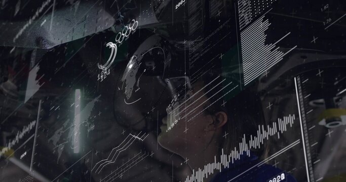 Studying female technician wearing headset and dark jacket, viewing holographic charts in lab