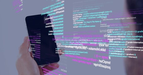 Fototapeta premium Holding black smartphone in left hand at studio showing code overlay blurred shoulder, copy space