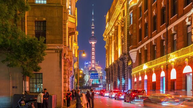 Time lapse of Tourists sightseeing around Shanghai city at night, China.