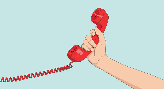 Human hand holds a classic red telephone receiver with a coiled cord against a solid light blue background color.