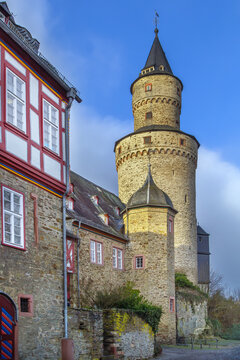 Hexenturm Witches Tower in Idstein, Germany. Tall stone medieval landmark under clear blue sky with no people