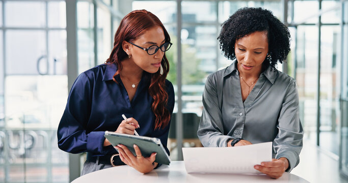Women, team and tablet with documents at office for review, insight or planning at insurance company. People, tech and discussion for paperwork, feedback and app for project at risk management agency