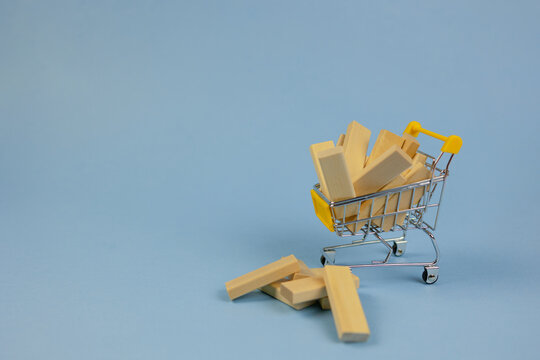 spilled wooden toys clutter warehouse shelves, supply overflow causes chaotic scene in storage area, restocking effort disrupted by spilled wooden pieces and scattered inventory materials