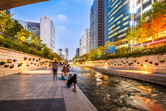 Cheonggyecheon Stream in Seoul Myeong-dong at twilight with city lights