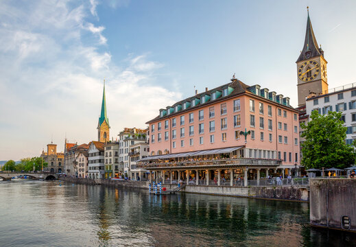 Zurich riverfront with Fraum�nster and St. Peter church at sunset