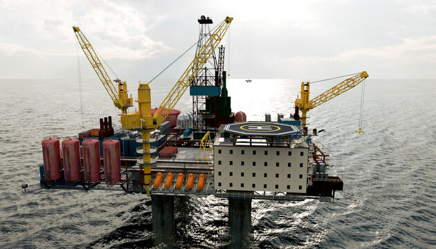 Offshore oil rig platform with cranes on ocean under cloudy sky