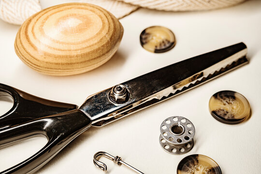 Sewing accessories and tools with button fabric and scissors still life