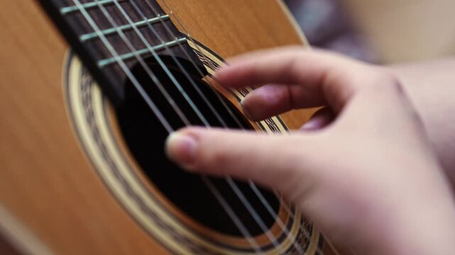 Learning to play guitar strings step by step with hands