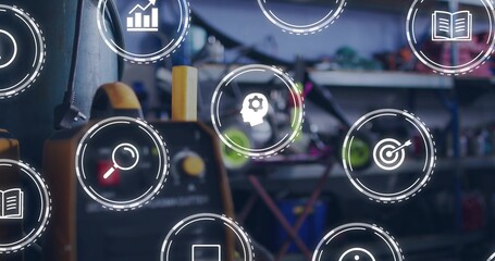 Displaying yellow-and-black battery charger with knobs and cables in workshop, with UI icons © vectorfusionart