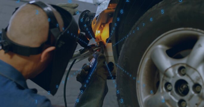 Welding welder in garage, helmet and leather gloves fixing panel by wheel with torch, blue overlay