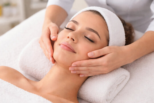 a person is getting a facial massage close-up, empty space for text, template, photo background, layout, banner, advertising