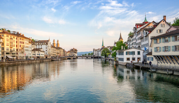 Panoramic view of Zurich at sunset with river Limmat and historic churches