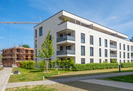 Modern energy-efficient apartment building and construction site in Neus��