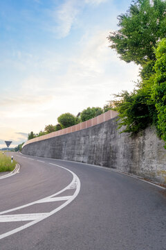 Public solar fence along curved road in Schmerikon Switzerland daylight
