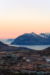Fototapeta premium Arctic fjord and mountain silhouette at sunset