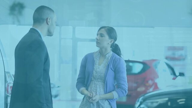 Animation of data processing over caucasian woman with businessman in car salon