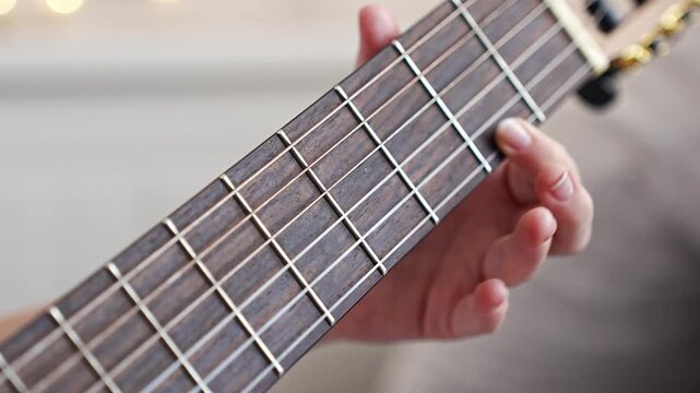 Learn basic guitar chords to play simple songs at home