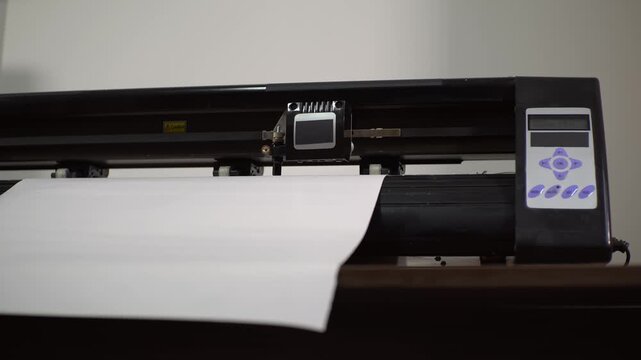 Cutting plotter. Flatbed plotter. Slow motion video. High quality 4k footage