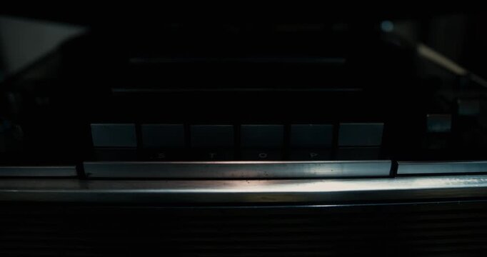 Opening and closing the lid of a vintage tape recorder