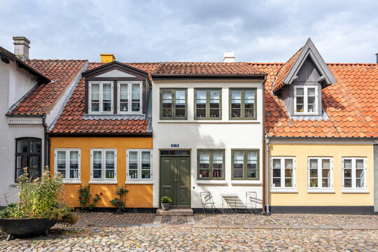 Traditional house facade in old town Odense Denmark with cobblestone street
