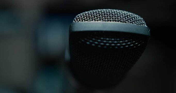 Close-up shot of a microphone in dim light