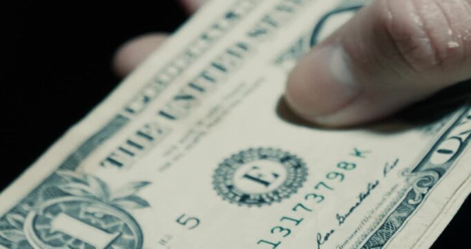 Female hands counting hundred dollar bills.