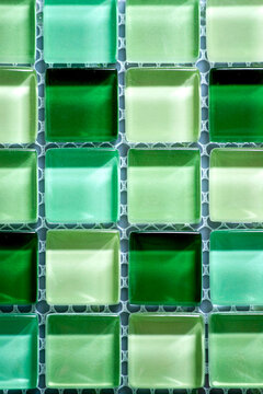 Green Glass Tile Pattern Background with Repeating Square Mosaic Texture