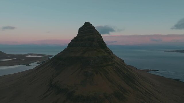 4K Drone Pull Back from Kirkjufell Mountain at Sunset Cinematic Aerial Shot