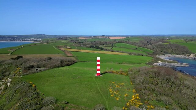 Gribbin Head, Cornwall, England: DRONE VIEWS: A circling view of the Gribbin Daymark (Gribbin Head Tower). The Daymark was erected in 1832 as an aid for seafarers to identify the River Fowey estuary.